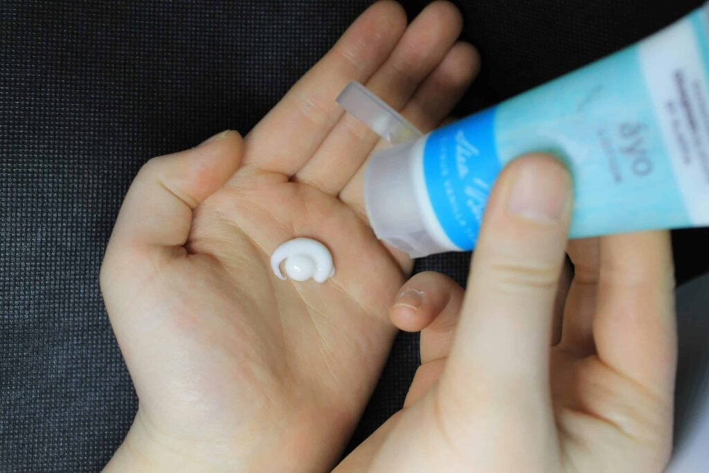 eczema flares up as depicted by cream being applied to hands