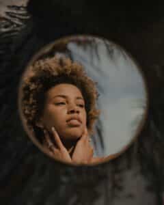 chemical peel for hyperpigmentation as depicted by woman in mirror