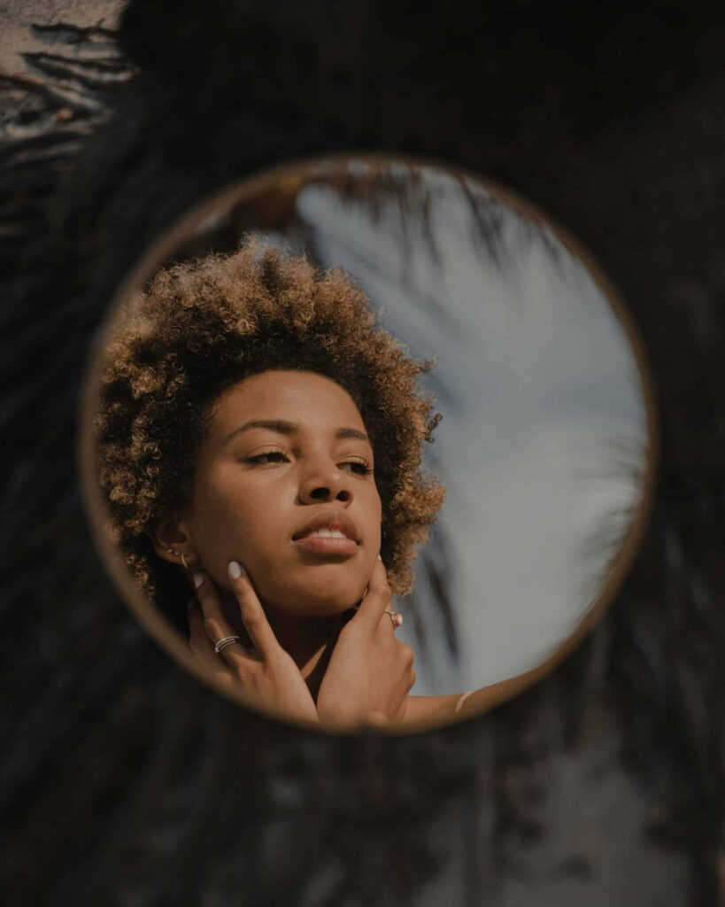 chemical peel for hyperpigmentation chemical peel for hyperpigmentation as depicted by woman in mirror