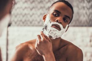 how to gret rid of razor bumps? Man shaving.