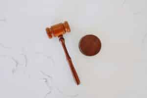 dermatology expert witness as depicted by a judge's gavel