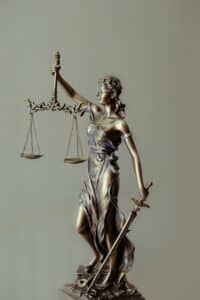 Independent Medical Examination as symbolized by a statue of Lady Justice.