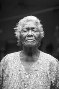 Botox for downturned mouth as depicted by an older woman with eyes closed