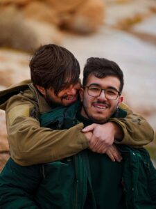 dermatologist for herpes as depicted by two men hugging