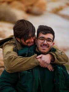 dermatologist for herpes as depicted by two men hugging