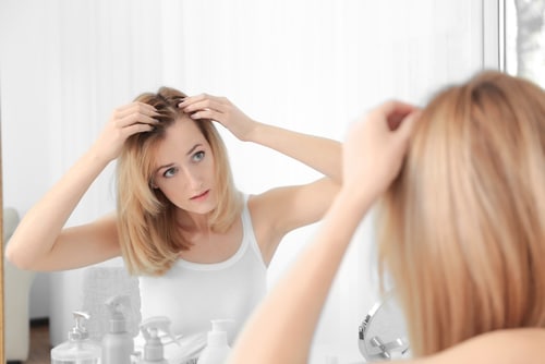 Young,Woman,With,Hair,Loss,Problem,Looking,In,Mirror,At Young,Woman,With,Hair,Loss,Problem,Looking,In,Mirror,At