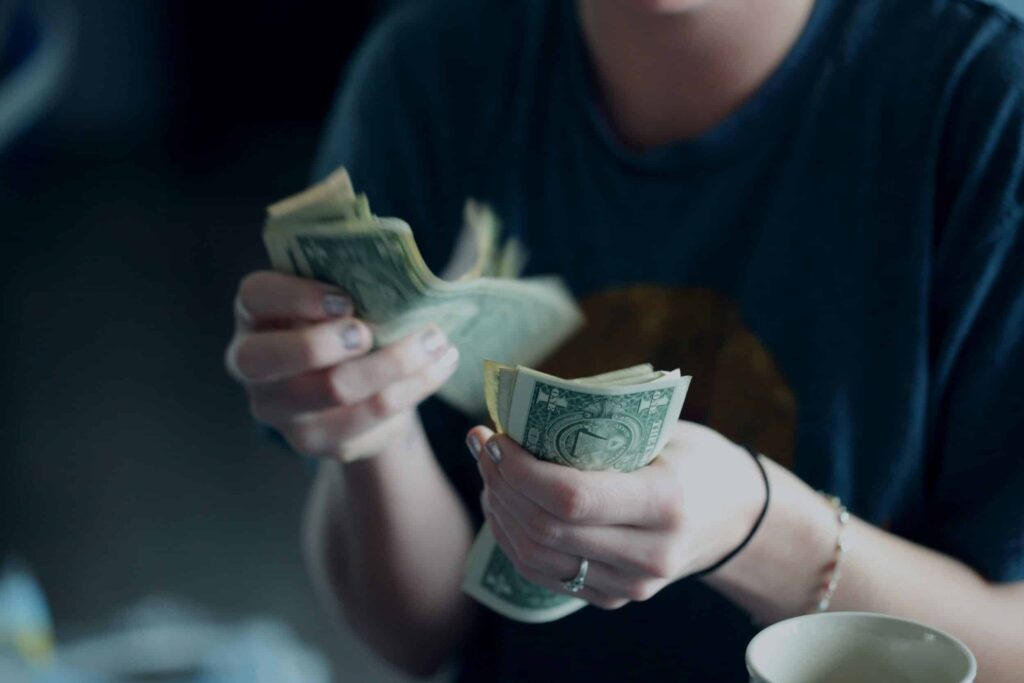 exosomes for hair loss costs exosomes for hair loss as depicted by woman counting money
