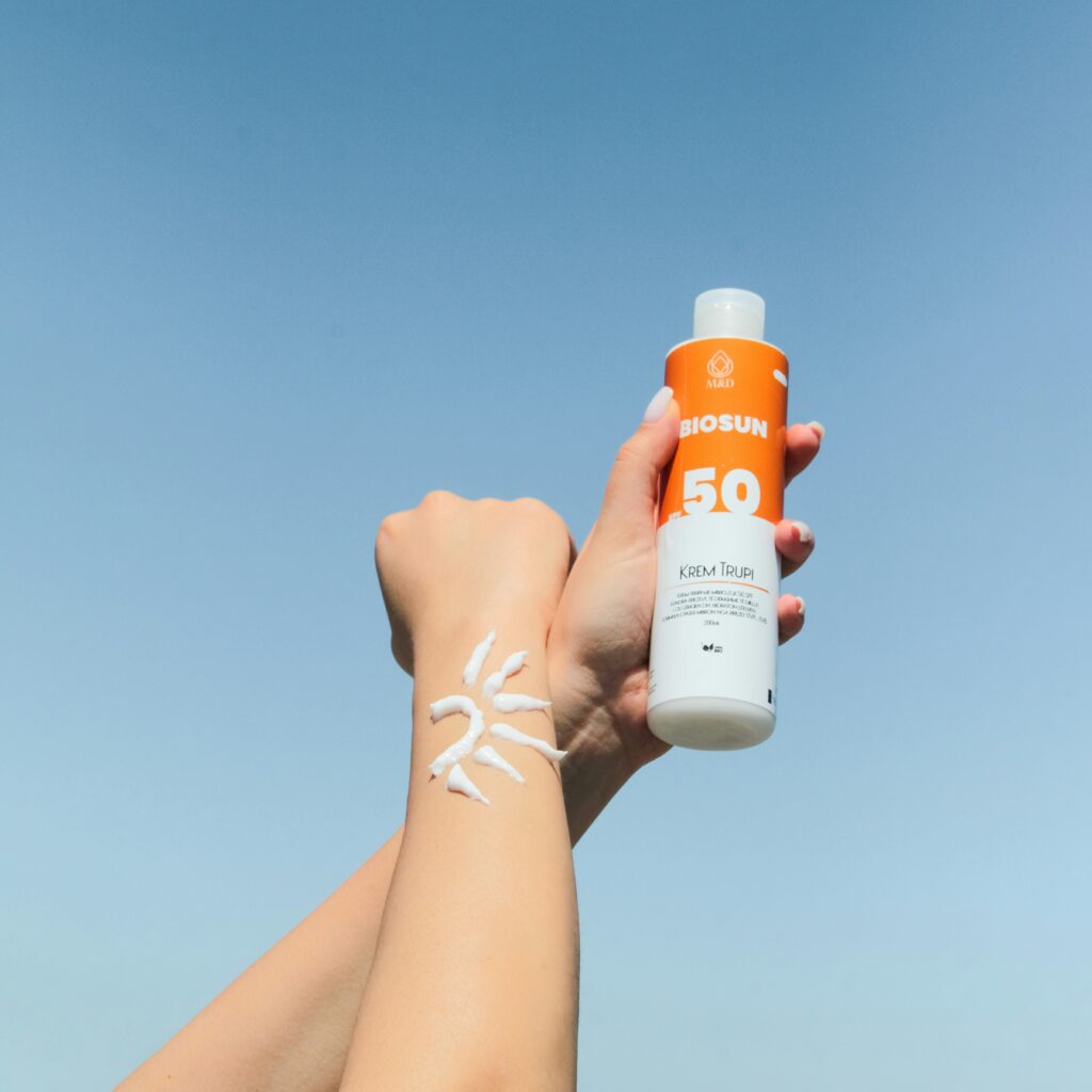 Does sunscreen expire as depicted by forearms holding a can with cream on forearm